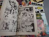 a lot of comic books that are on a table
