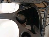 a black and white computer mouse sitting on top of a desk