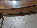 a wooden table with a mirror on top of it