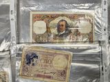 many different types of paper money on the table