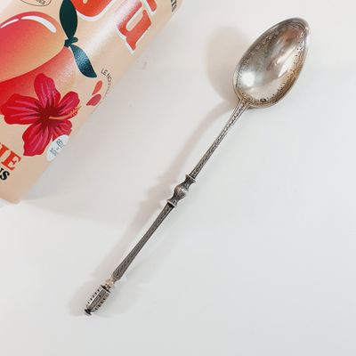a spoon and a book sitting on a table