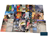 a lot of posters of different motorcycles on a table
