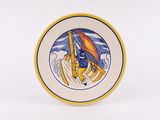 an image of a plate with a picture of a man on a boat