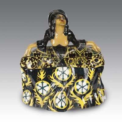 an image of a black and yellow box with a woman sitting on it