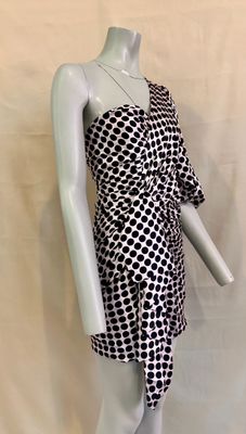 a mannequin wearing a black and white dress on a mannequin mannequin