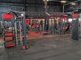 a large gym with a lot of equipment in it
