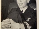 black and white photograph of a man in a military uniform holding his hands together