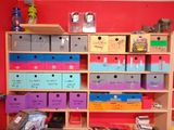 many boxes on the shelves in the room