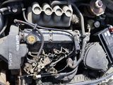 a picture of a car engine with the hood open