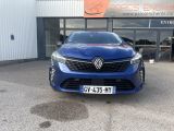 the front of a blue car parked in front of a building