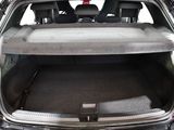 the back of a car with the trunk open and the seats down