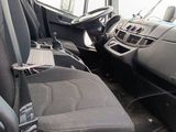 a picture of the inside of a van with the seats down