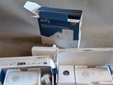 two wii controllers in the box on the floor