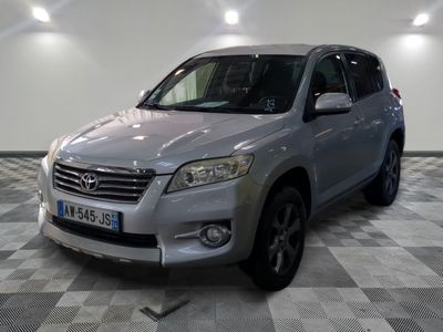 a picture of a silver toyota rav parked in a garage