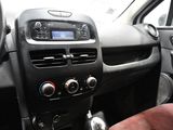 a dashboard of a car with a radio and a steering wheel