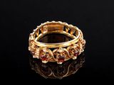 a close up of a gold ring on a black surface