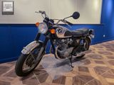 a motorcycle that is sitting on the floor in the room