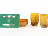 three glasses and a credit card sitting next to each other
