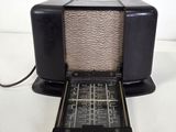an old radio that is sitting on top of a table