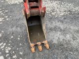 a red bulldozer that is sitting in the dirt