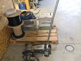a picture of a garage with tools on a pallet