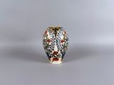 a small vase that is sitting on a table