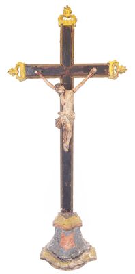 a statue of jesus on the cross on a white background