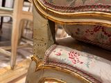 a close up of a chair and a table in a room