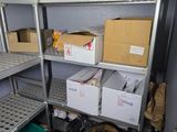 a room with shelves and bins of food in it