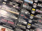 a lot of movies on the table with a lot of stickers on it