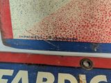 a red and blue sign that says fabric on it