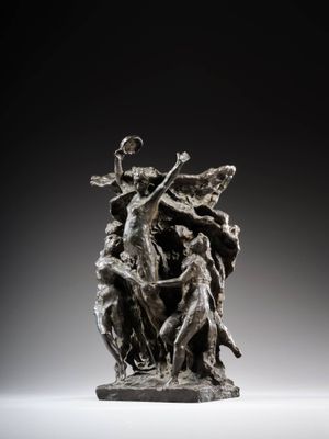 a bronze statue of a woman holding a child in her arms
