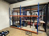 a room with a lot of shelves and tools in it