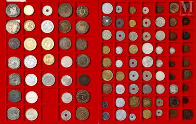 a lot of coins that are in a red box