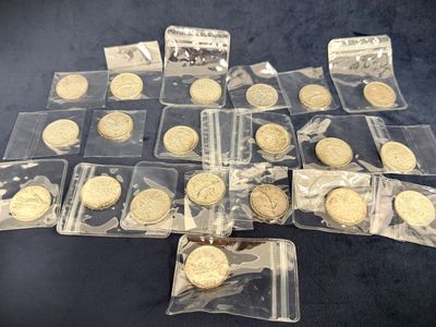 some of the gold coins are in plastic bags on a table