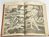 an open book with a picture of a man and a woman in a landscape