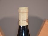 a bottle of wine that is sitting on a table