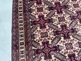 an image of a large oriental rug on a blue floor