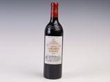 bottle of red wine with a white label on a grey background