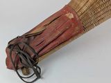 an old baseball bat with a glove on it