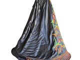 an image of a dress hanging on a hanger on a white background