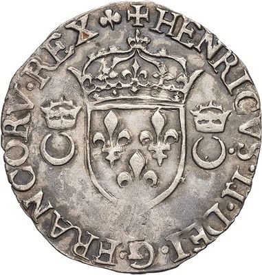 a silver coin with a crown on top of it