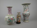 three vases are sitting next to each other on a table