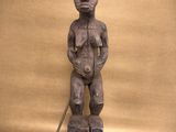 an image of a statue of a man standing on a block