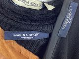 black and brown jacket with a blue label on a mannequin mannequin mannequin mannequin mannequin mannequin mannequin mann