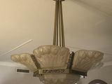 a chandelier hanging from the ceiling in a living room