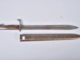 an old knife and a small knife on a white surface