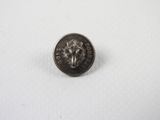 a close up of a coin on a white surface