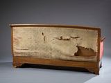 a very old wooden bench with peeling paint on it