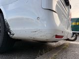 a white van that is parked on the side of the road